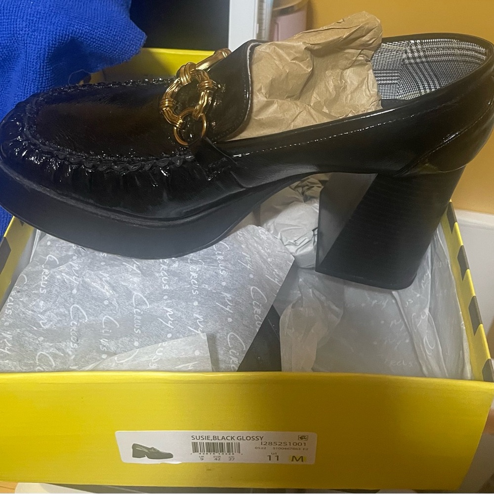 Black platform with gold accents